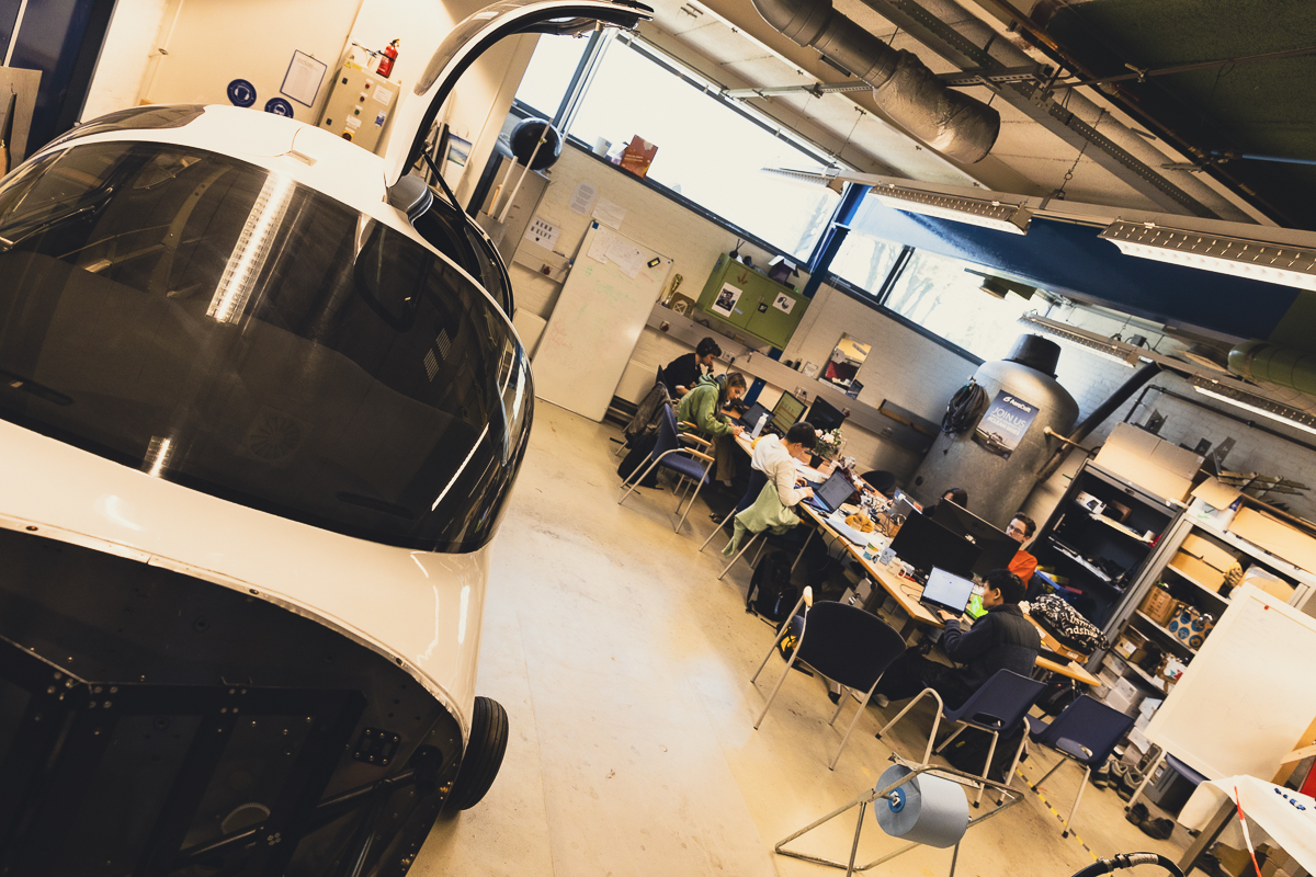 Photo: one of the development rooms at AeroDelft. With a partially assembled hydrogen-powered prototype aircraft in the foreground.
